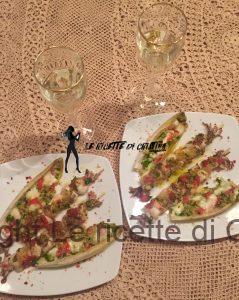 Spiedini di pesce al forno con barchette d'indivia belga