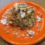 Risotto cacio e pepe ai carciofi con stracciatella e briciole di pane tostato all'aglio